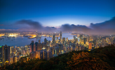 Aerial view of Hong Kong Central district and Victoria Harbour at twilight, China