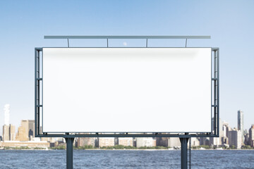 Blank white billboard on city buildings background at daytime, front view. Mockup, advertising concept