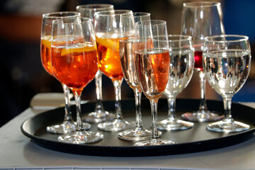 Tablet with cold drinks, Aperol Spritz, wine, champagne, water, aperitif, alcohol, party...