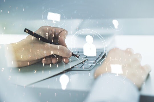 Double exposure of social network icons concept with hand writing in notebook on background with laptop. Marketing and promotion concept