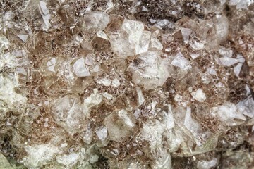 Close-up of natural white quartz druse geode mineral crystal unpolished semi-precious gemstone....