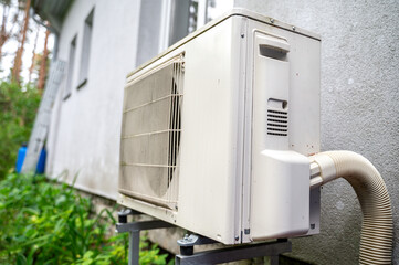 Heat pump outside of residential house at summer