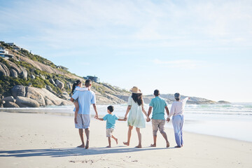 Beach, holding hands and grandparents, parents and kids for bonding, quality time and relax in nature. Family, travel and mom, dad and children walking by ocean on holiday, vacation and adventure
