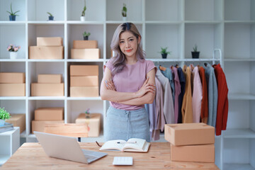 Portrait Of Asian Female Owner Of Fashion Store Clothing Store successful happy smile at small business, sme or ecommerce concepts