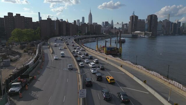 alt flying over FDR Drive traffic towards midtown NYC skyline