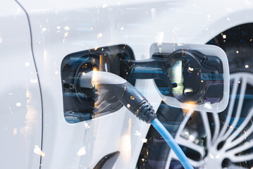 Fototapeta premium Electric vehicle , Smart car , Air pollution and reduce greenhouse gas emissions concept. Double exposure of charging Electric car with power cable supply plugged in and city night light view.