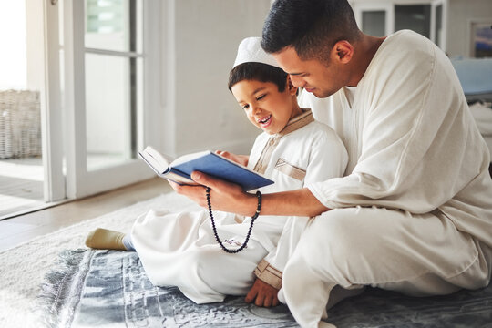 Quran, Muslim and father and happy kid praying to Allah, god or holy spirit for Arabic religion, faith and reading spiritual book. Prayer beads, home family study and Islamic dad teaching youth child