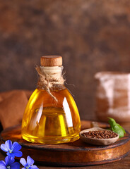 linseed oil in a bottle on a wooden table