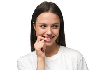 Fototapeta premium Shy beautiful young woman smiling and touching her lips