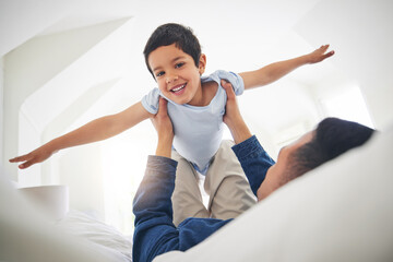 Airplane, portrait and boy child with father on a bed with love, bonding and having fun with game...