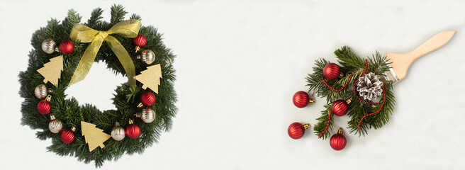 Christmas ring or wreath and paintbrush with red bead, spruce branch on the light background. Top view. Copy space.