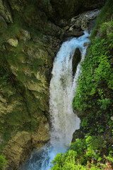 Fototapeta na wymiar A big waterfall in the gorge Wolfsklamm in Stans, Tirol - Austria