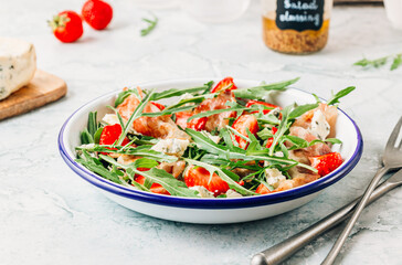 Summer strawberries salad with bacon and blue cheese