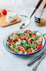 Summer strawberries salad with bacon and blue cheese
