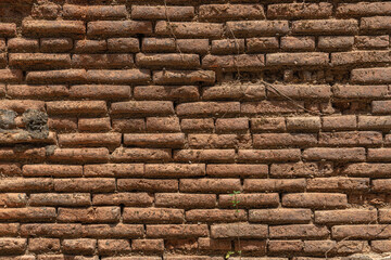 Texture background, brick wall of red old weathered brick,