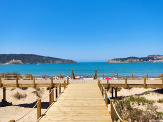 SAN MARTINHO, PORTUGAL – JULE 09, 2022: beautiful beach on the bay and wooden walking paths