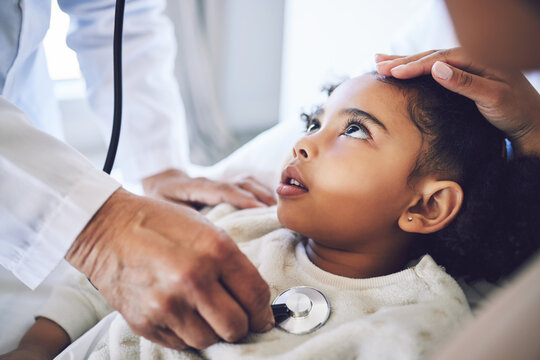 Hands, stethoscope and doctor with child for heart healthcare, breathing or check lungs for wellness in hospital. Girl, medical professional or pediatrician with cardiology instrument in consultation