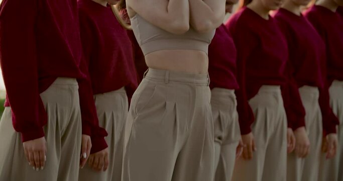 Professional dancers performing an interpretive dance outdoors, 4k