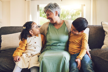 Laughing, grandmother or happy kids on a sofa with love enjoying quality bonding time together in...