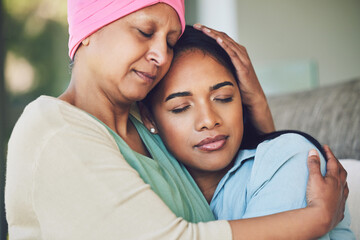 Family, old woman hugging her daughter and love with people sitting on a sofa in the home living...