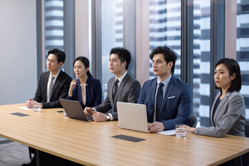 Confident Chinese business people having a meeting