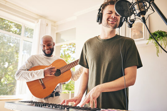 Piano, microphone and friends singing with guitar in home studio together. Electric keyboard, acoustic instrument or recording for collaboration, creative music production and headphones of happy men