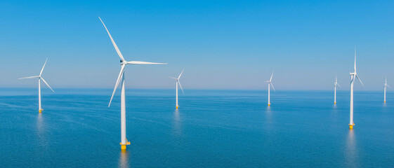 Windmill Park with windmill turbines and a blue sky , windmill turbines park in the ocean....