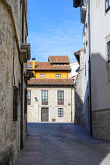 Vacation on Green coast of Asturias, views of Llanes touristic city with old harbour, North of Spain