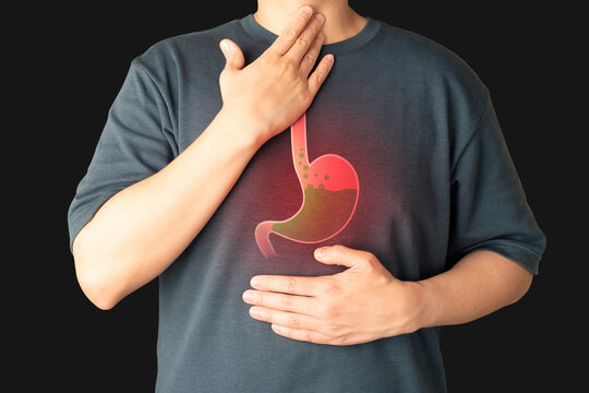 Gastroesophageal reflux disease (GERD) or acid reflux symptoms. Man suffering from heartburn, stomachache, nausea and bloating. Gastrointestinal system disease and digestive problems.