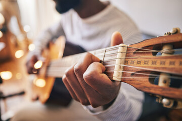 Closeup, hands of man and guitar for music, live talent and creative skill of sound production in...