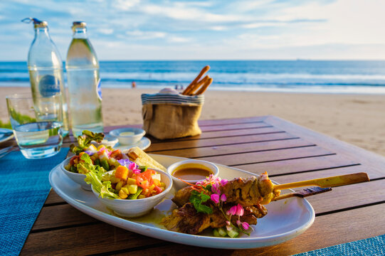 Thai food on a table on the beach in Thailand. table with Thai food Thai sate