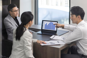 Confident Chinese business people having a meeting