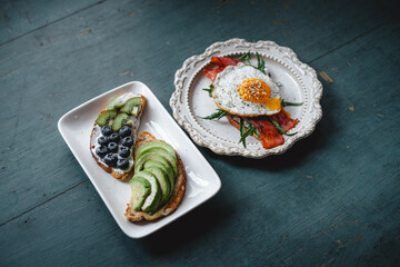 Breakfast Avocado and Blueberry Toast and Bacon Fried Egg Toast