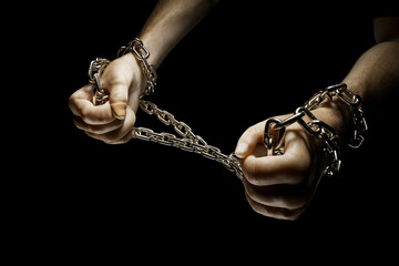 Hands breaking chains. Metal or steel chain is blown to pieces. Break free.