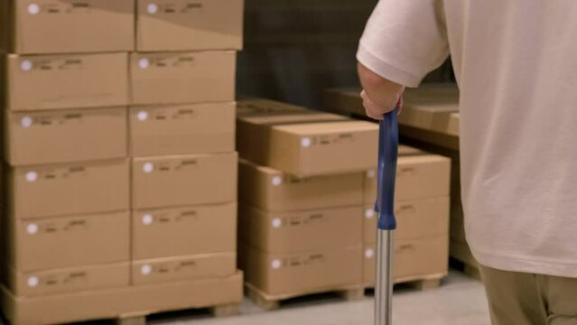 man carries large shopping trolley in self-service furniture store, shopping for goods DIY and Home Improvement, individuals stack and transport furniture for own projects, Budget-Friendly Shopping