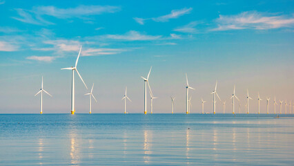 Windmill turbines Park with a blue sky, windmill turbines park in the ocean. Netherlands Europe the...