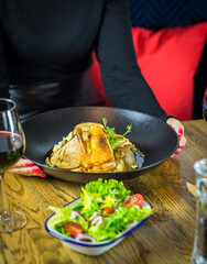 person eating chicken dish