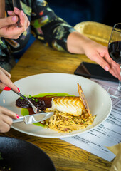 person holding a plate of food