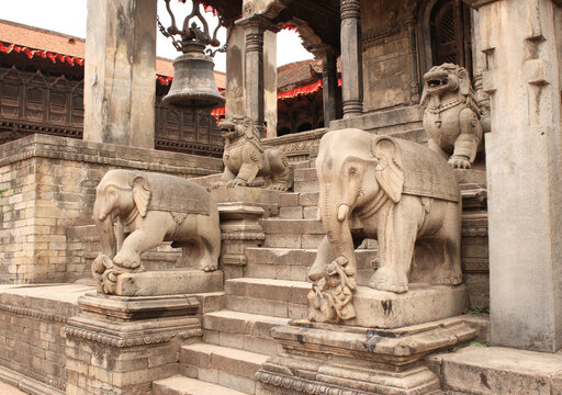 Ancient stone statue of elephants and dogs on steps in Bhaktapur, Kathmandu valley, Nepal. UNESCO World Heritage Site