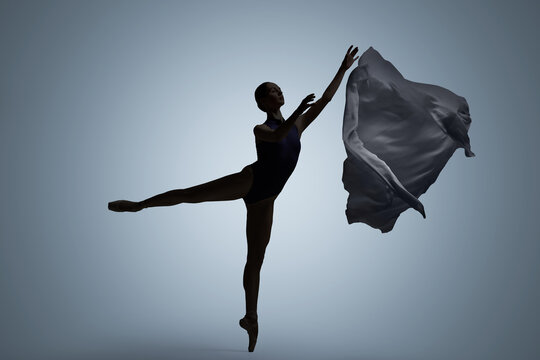 Beautiful ballerina with veil dancing on light grey background. Dark silhouette of dancer
