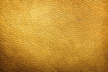 Golden textured surface as background, closeup view