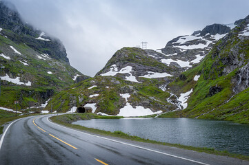 Tunnel through the mountain at scenic norwegian road. Norway.