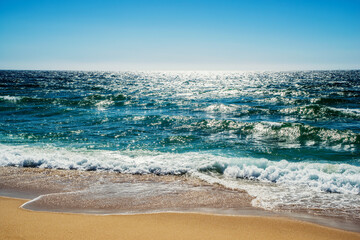 Idyllic wild beach in summertime. Atlantic Ocean, Portugal.