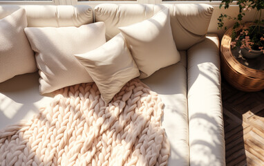 Fototapeta na wymiar Beige fabric sofa with fluffy cotton blanket and cushions in dappled sunlight, window shadows—an ideal 3D background for interior decoration and product displays.