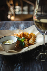 Crispy shrimp in batter with cheese sauce