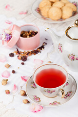 cup of red tea on white serving table