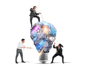 Teamwork of businesspeople work together to a lightbulb system of gears