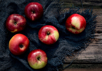 Apples on rustic background, top view