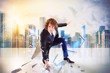 Business man punch with power and determination in the floor of roof