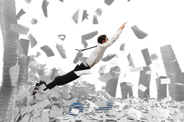 Businessman goes out from a pile of paper sheets